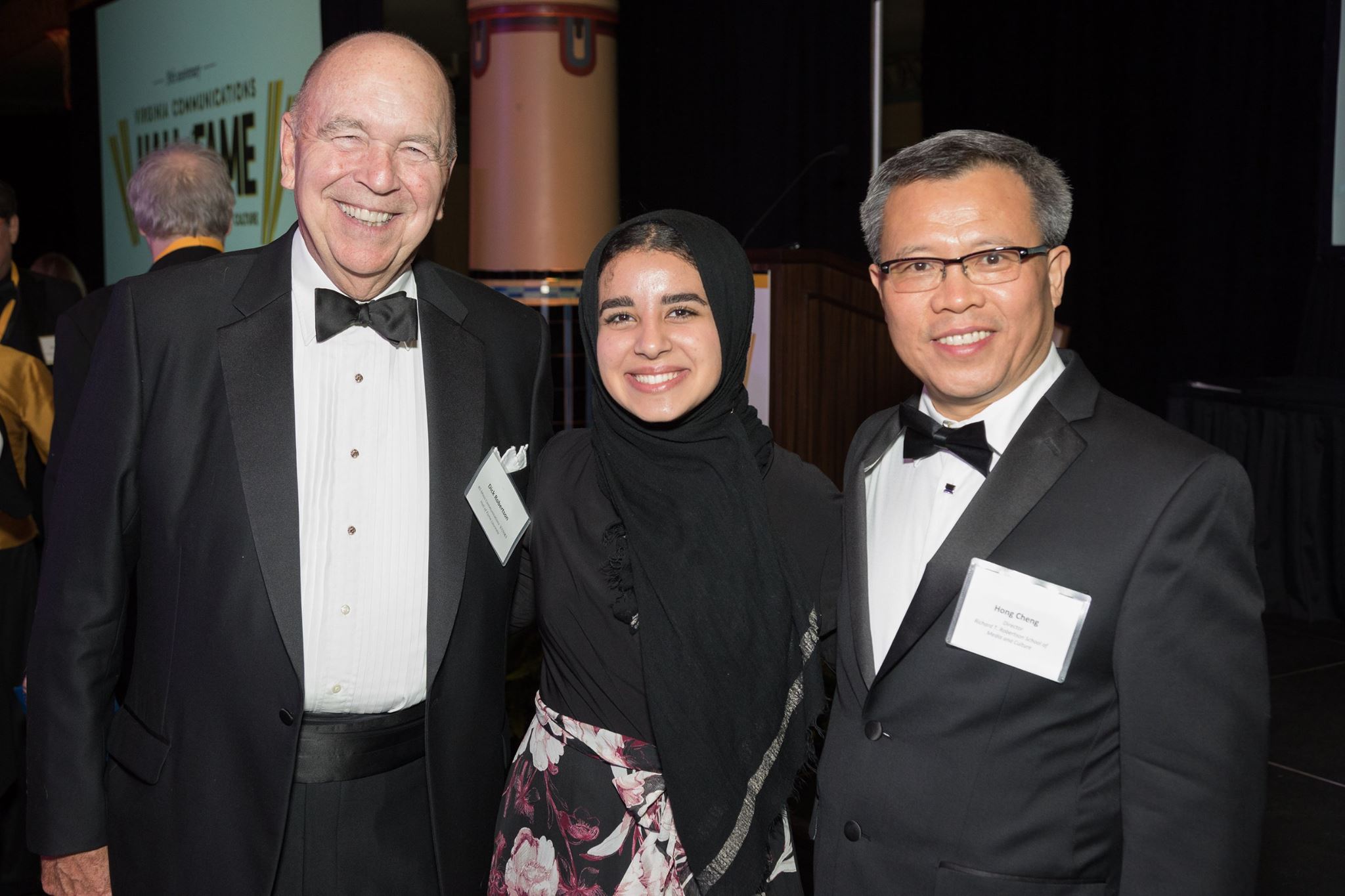 Maryum standing with former Robertson School of Media and Culture Chair, Hong Cheng and Robertson School donor Rick Robertson