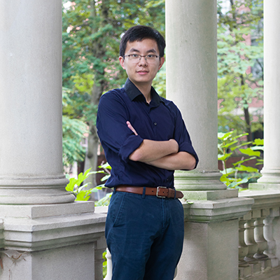 Andy Nguyen wearing dark blue dress clothes witha  brown belt.