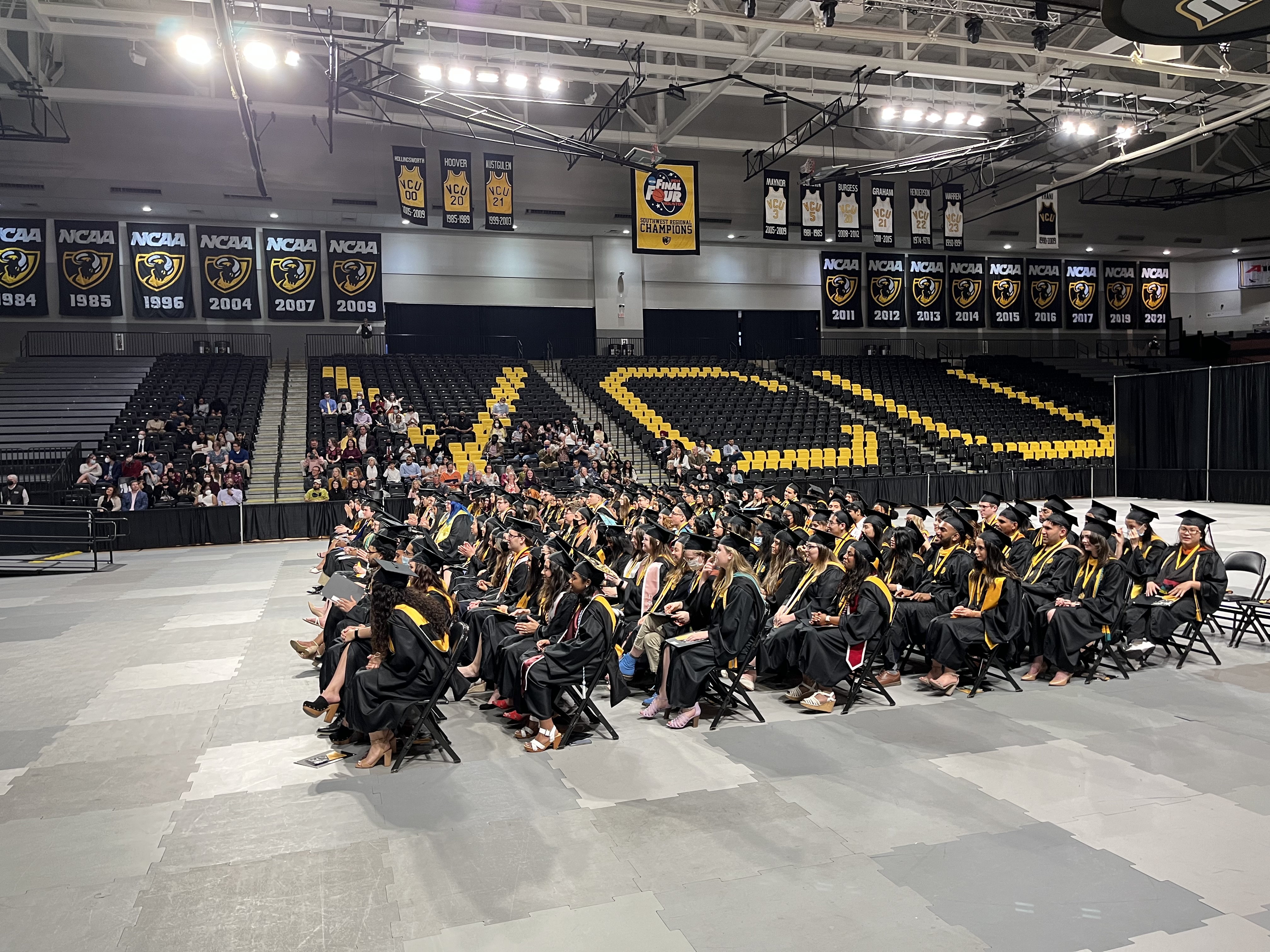 Honors Spring 2022 graduates sit in the Siegel Center during commencement