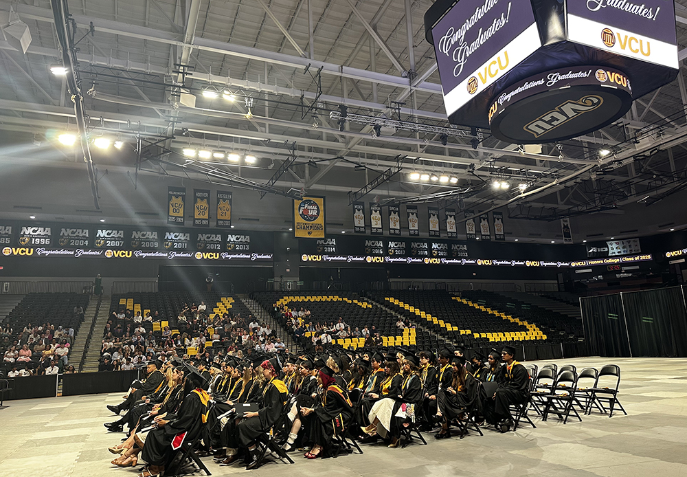 The Honors Grad Class Spring 2025 sits in the Siegel Center during commencement