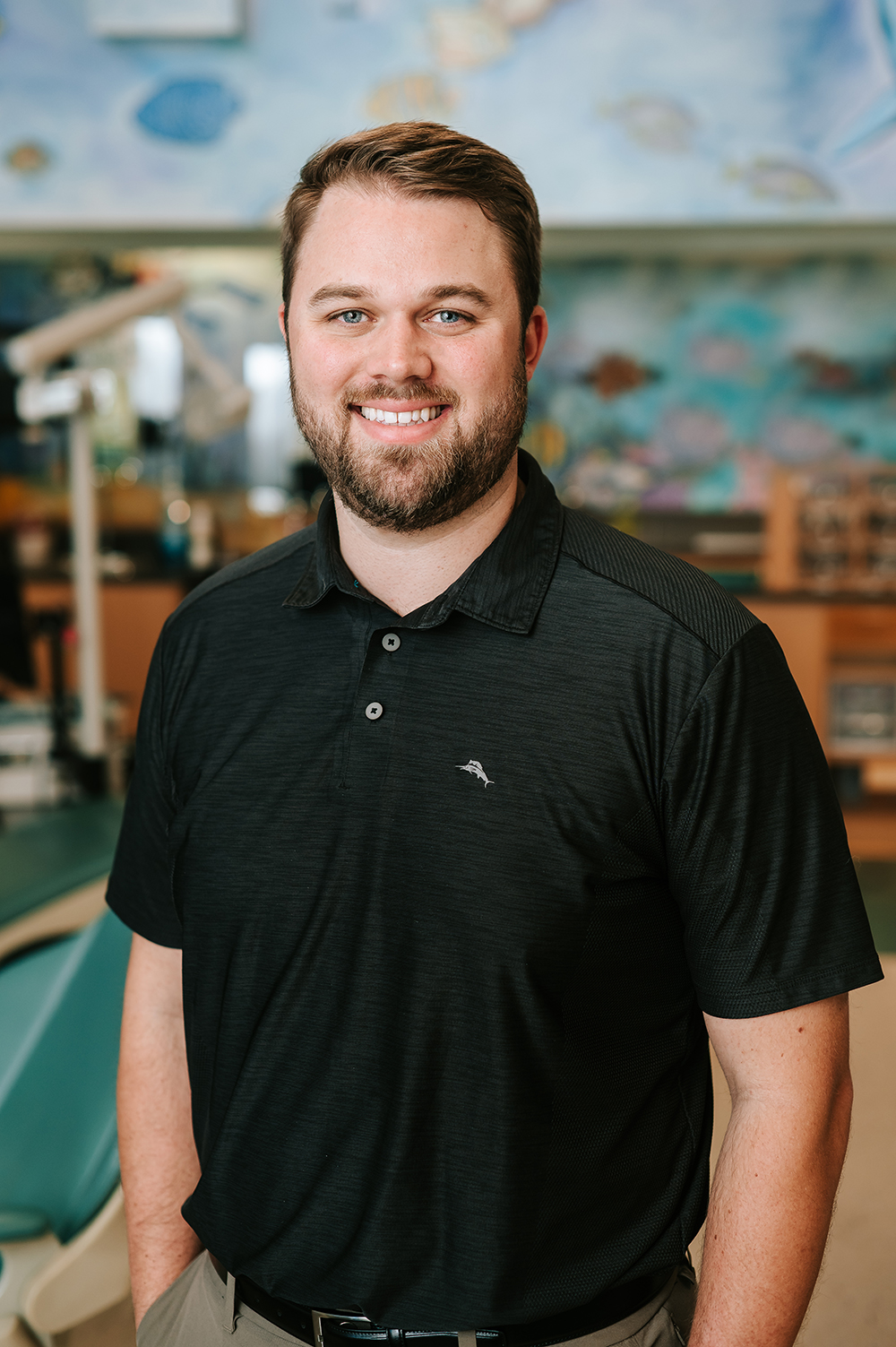 Hunter Lee stands at his orthodontic practice