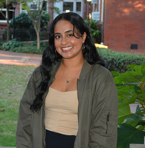 Neha Madakasira standing in a courtyard on V C U's campus
