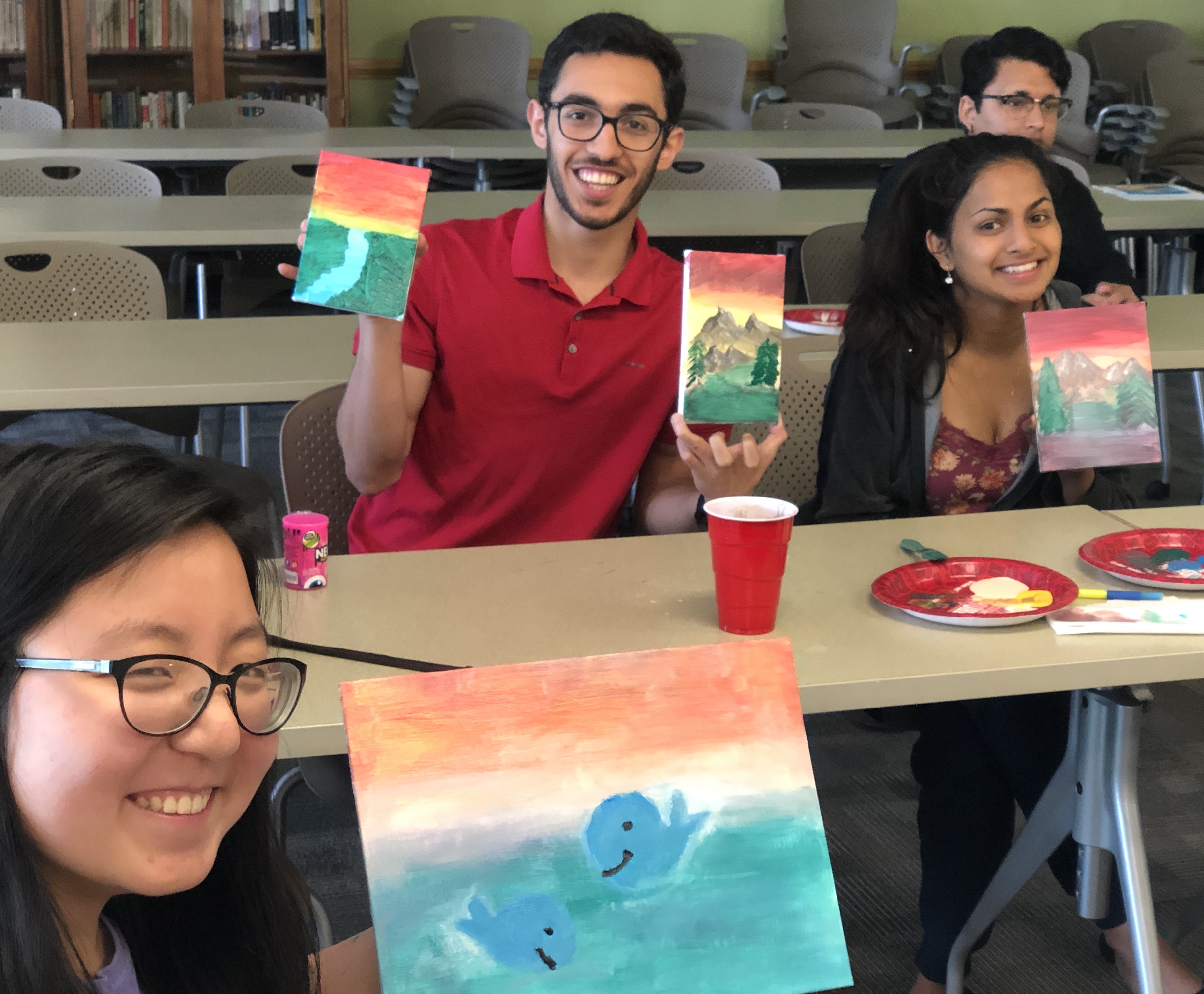 Honors Students display their paintings from a Wind Down Wednesday session