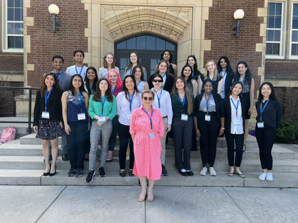 Honors College professor Faye Prichard stands with 24 student presenters at the national conference for undergraduate research