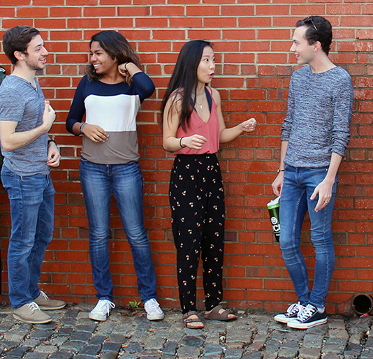 A group of Honors College students talk with one another.
