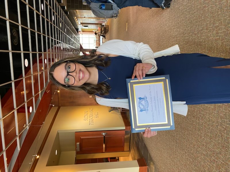 Kameron Jones poses with her Emerging Scholar of the Year Award